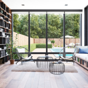 A luxury home with floor-to-ceiling windows and custom furniture