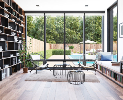 A luxury home with floor-to-ceiling windows and custom furniture