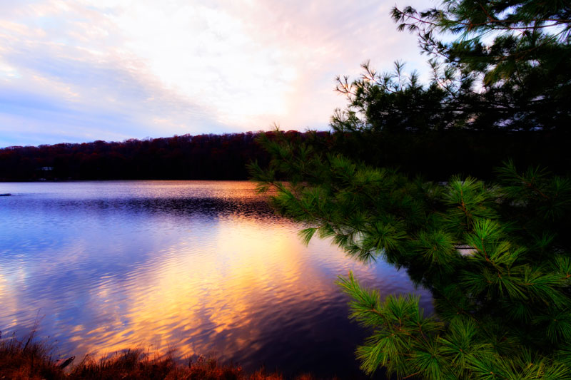 A beautiful view of a sunset over water.