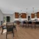 An open-concept kitchen, dining room, and living room space on the main floor of a family home.