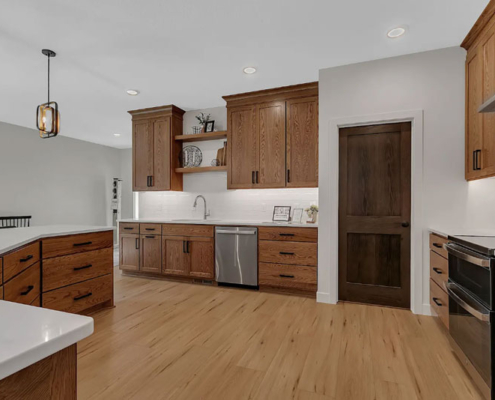 A spacious patio home kitchen with a built-in storage pantry.