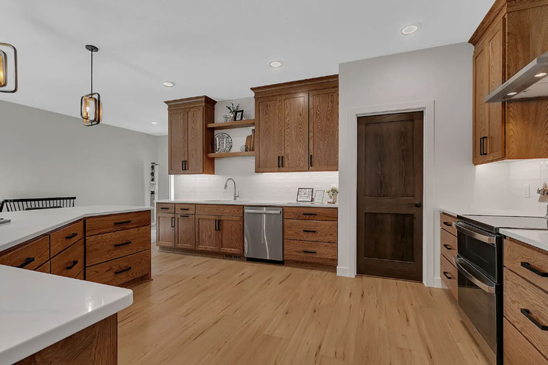 A spacious patio home kitchen with a built-in storage pantry.